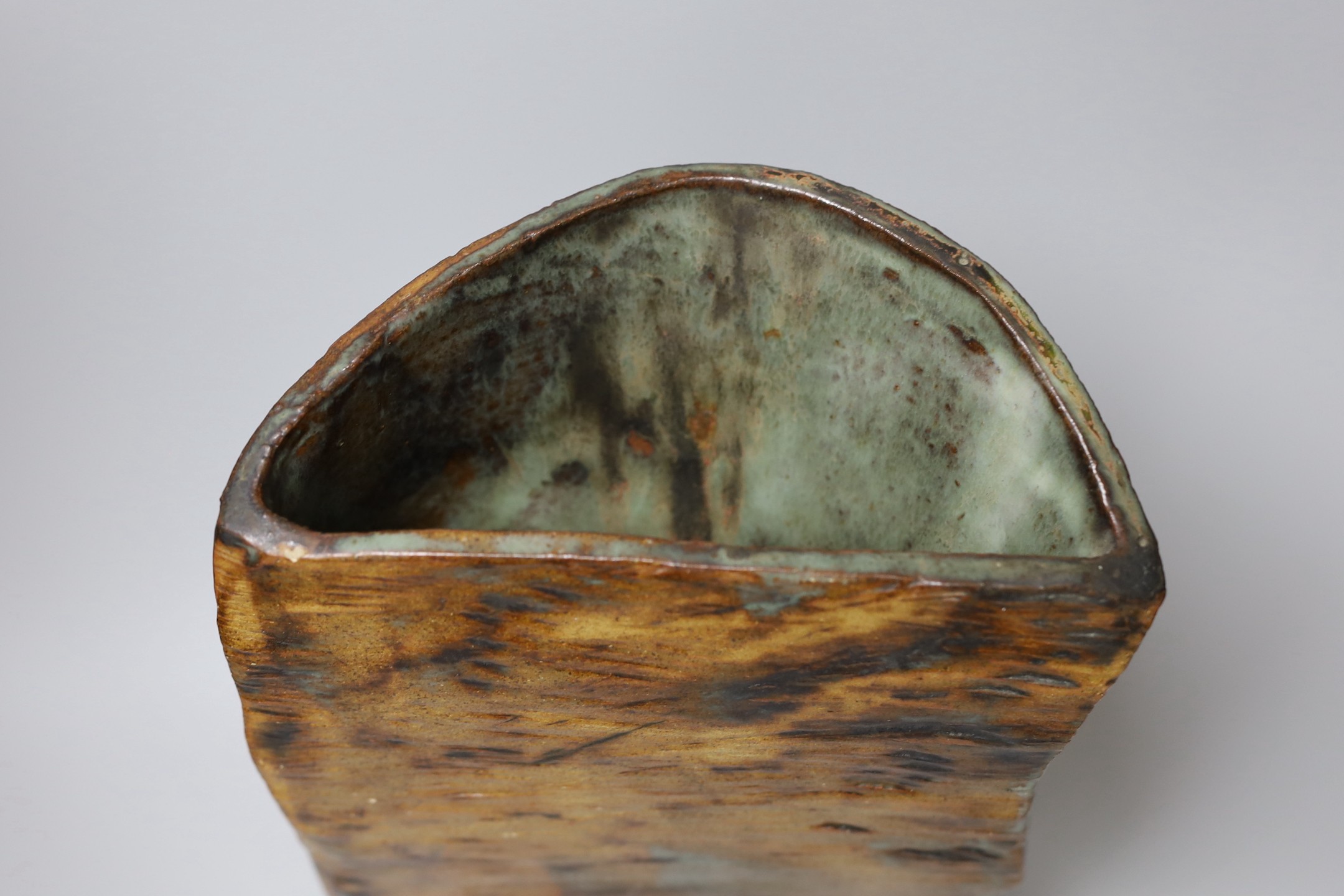 Ruth Sulke - a studio stoneware green and brown glazed free-form vase, 37cm